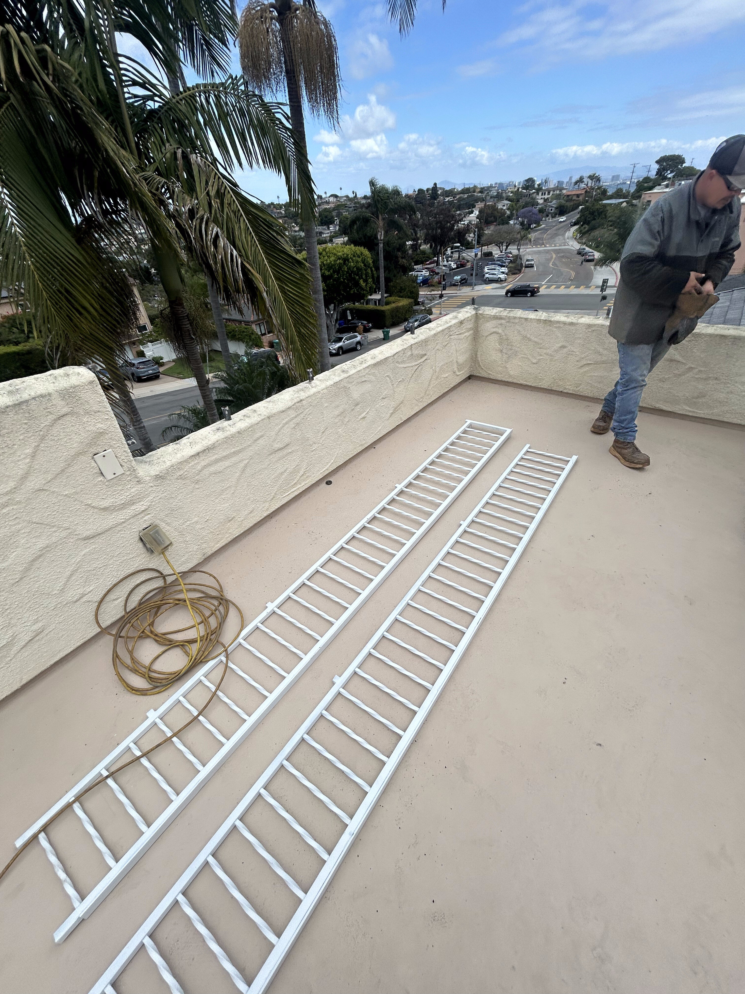 Freshly painted railings staged on a rooftop deck